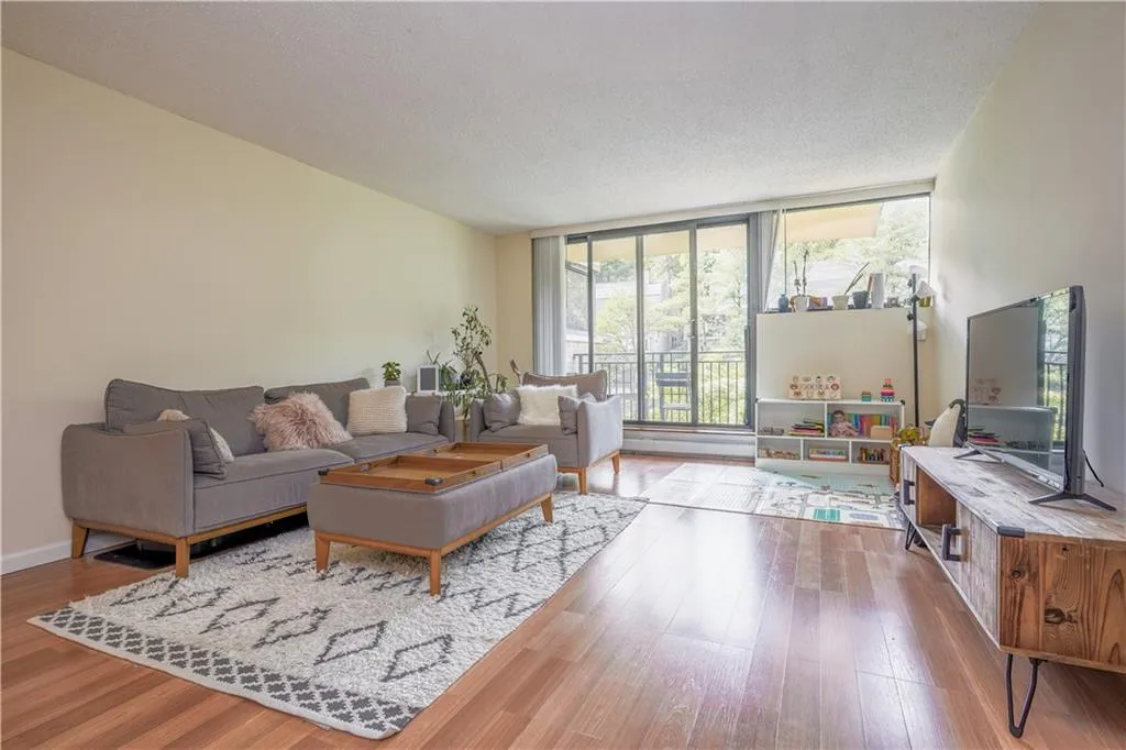 Living room at 25 Rockledge Avenue #302 in White Plains with sliding doors to a balcony