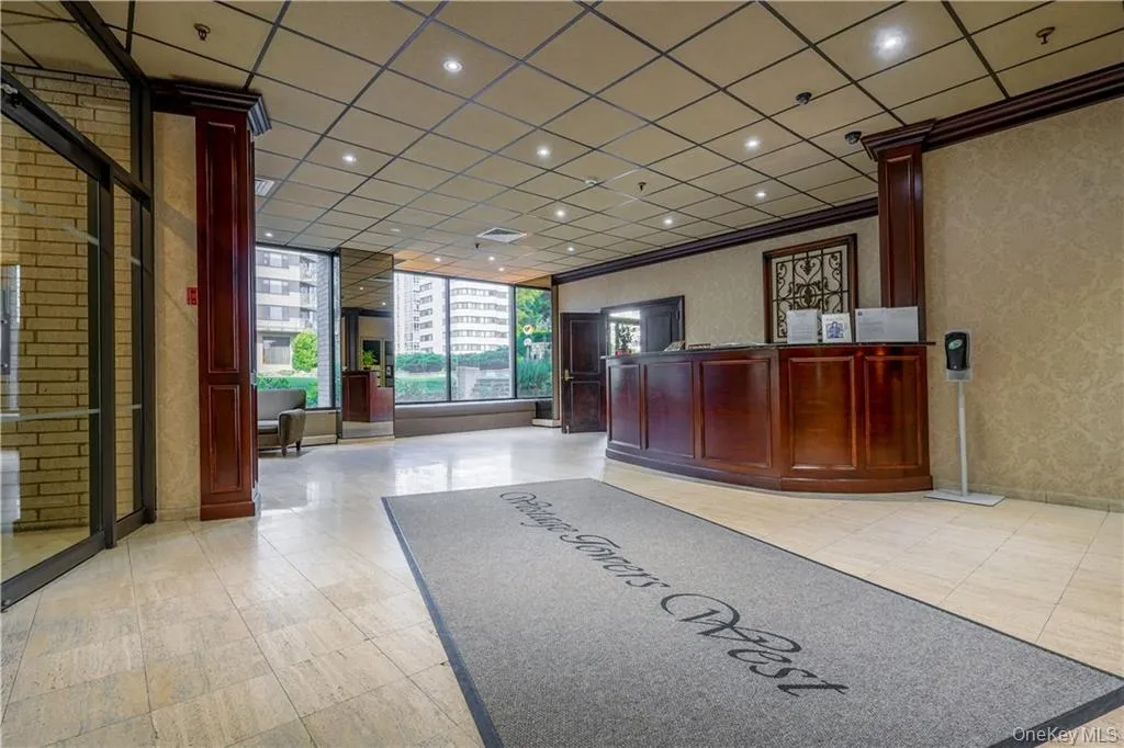 Lobby of the building at 25 Rockledge Avenue in White Plains, with a wood reception desk