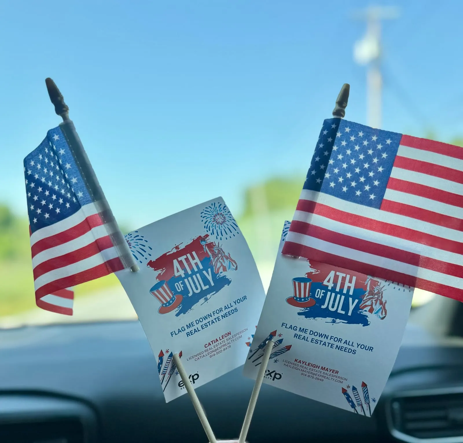 Two small American flags with CK Team Fourth of July cards