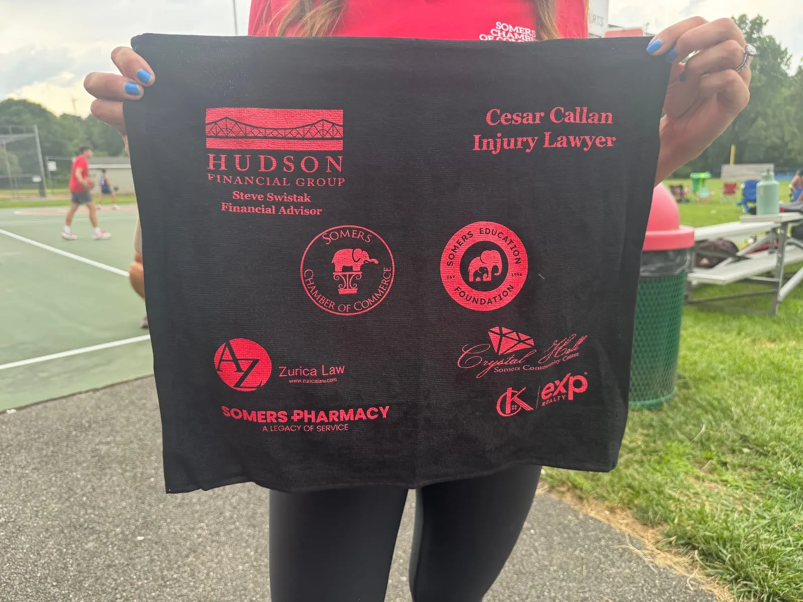 Event towel printed with the Somers Chamber of Commerce, Somers Education Foundation and CK Team logos