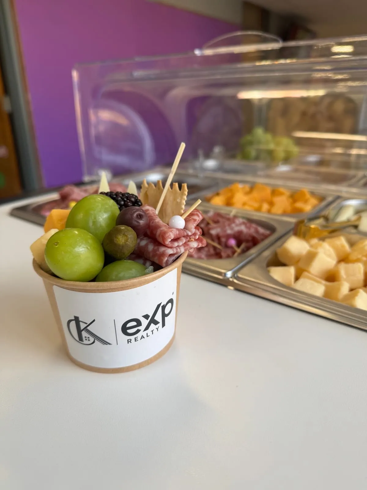 CK Team charcuterie cup with salami, cheese, olives and grapes