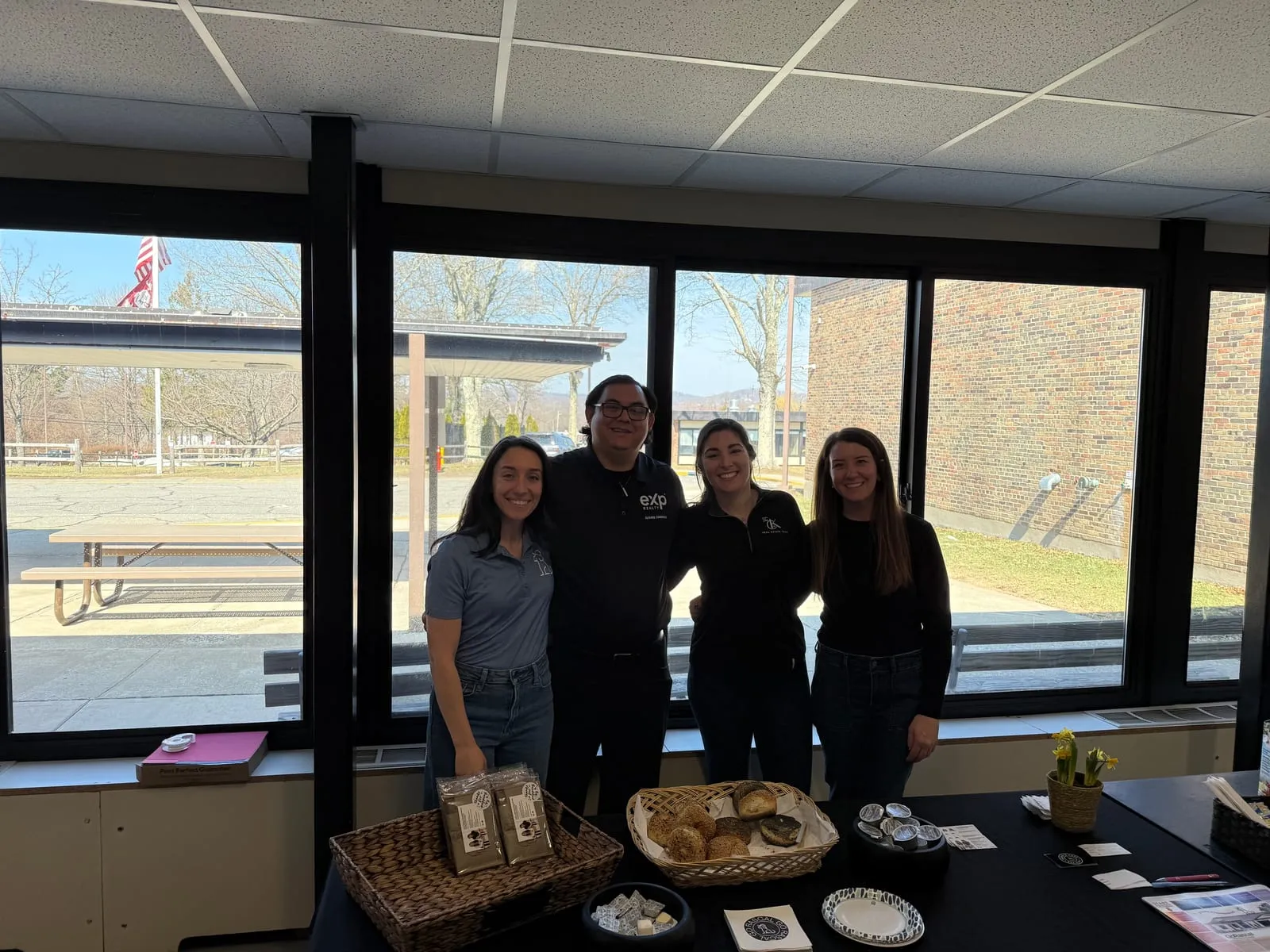 The CK Team and Johna from GoRascal behind a breakfast table set out for teachers